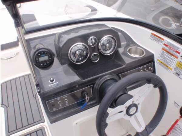 motor boat control panel and steering wheel